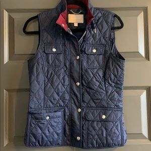 Blue vest with red and silver detail